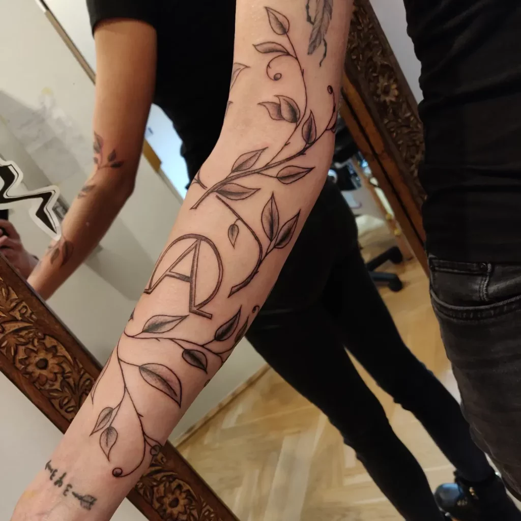 Freehand floral sleeve tattoo, black and grey